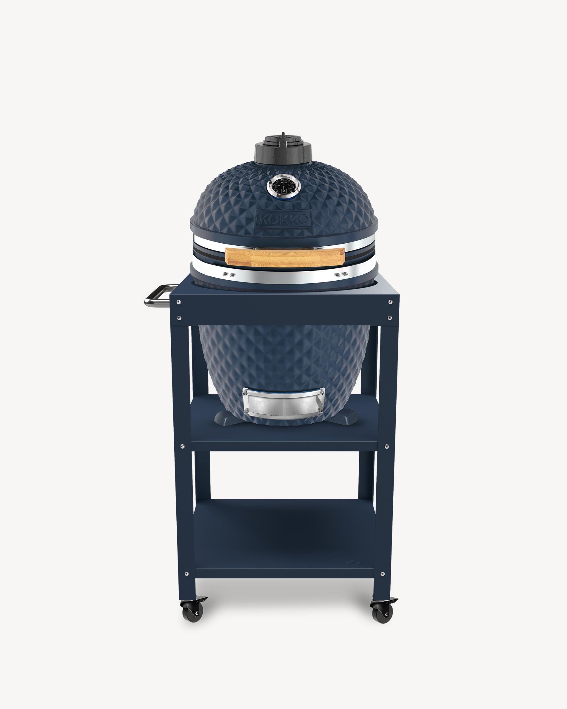 Kamado-Grill Kokko L 18 Zoll in Navy, auf Beistelltisch mit Stauraum und Rollen installiert.